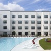 pool with lounge area and lawn games at broadstone amelia in houston, texas