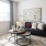 living room with a large window and couch