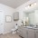 bathroom with a large mirror