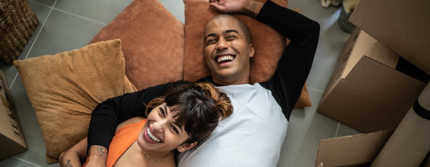 a man and woman lying on a couch